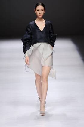 BEIJING, CHINA - MARCH 29: (CHINA OUT) A model showcases designs on the runway at Beijing Institute of Fashion Technology¡¤Emerging Design Collection & BIFT¡¤ELLASSAY Scholarship Awarding Ceremony during the Mercedes-Benz China Fashion Week Autumn Winter 2016 2017 at Beijing Hotel on March 29, 2016 in Beijing, China.  CFP481872735