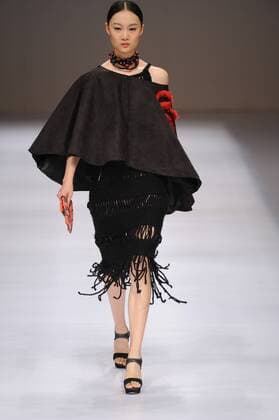 BEIJING, CHINA - MARCH 29: (CHINA OUT) A model showcases designs on the runway at Beijing Institute of Fashion Technology¡¤Emerging Design Collection & BIFT¡¤ELLASSAY Scholarship Awarding Ceremony during the Mercedes-Benz China Fashion Week Autumn Winter 2016 2017 at Beijing Hotel on March 29, 2016 in Beijing, China.  CFP481872763