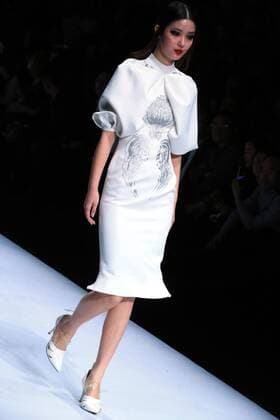BEIJING, March 29, 2016 -- A model presents a creation by designer Hao Jia during the China Fashion Week in Beijing, capital of China, March 29, 2016. ) (zwx) CHINA-BEIJING-FASHION WEEK(CN) LixMingfang 