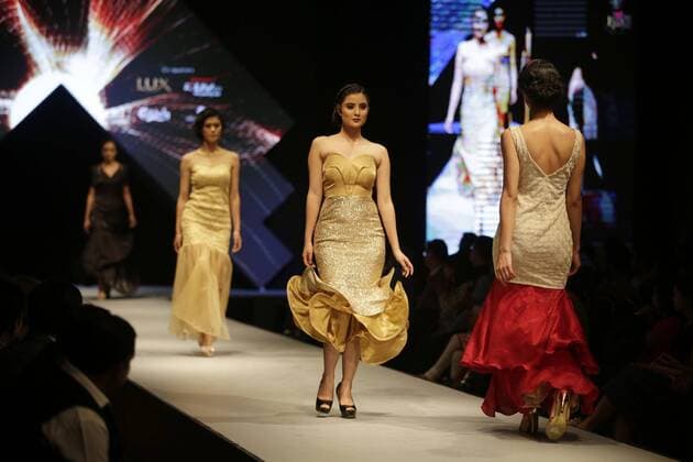 March 30, 2016 - Kathmandu, Nepal - Nepalese models catwalk on the runway during the Nepal fashion week also known as The Himalayan Times TGIF Nepal Fashion Week at Hyatt Regency in Kathmandu, Nepal on Wednesday, March 30, 2016. Celebrities and fashion models from around the world come to represent for the designers to promote their designs. The event is the top most fashion week of the country held annually by The Himalayan Times, a leading and largest selling English daily newspaper in Nepal. The fashion week lasts for 4 days with glitz and glamor on the catwalk. Kathmandu Nepal - ZUMAg200