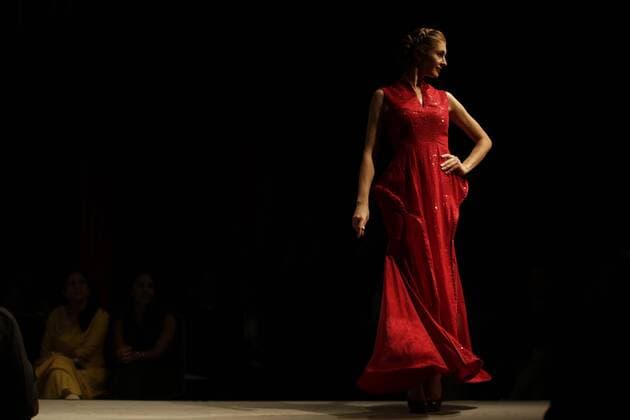 March 30, 2016 - Kathmandu, Nepal - A model catwalk on the runway during the Nepal fashion week also known as The Himalayan Times TGIF Nepal Fashion Week at Hyatt Regency in Kathmandu, Nepal on Wednesday, March 30, 2016. Celebrities and fashion models from around the world come to represent for the designers to promote their designs. The event is the top most fashion week of the country held annually by The Himalayan Times, a leading and largest selling English daily newspaper in Nepal. The fashion week lasts for 4 days with glitz and glamor on the catwalk. Kathmandu Nepal - ZUMAg200
