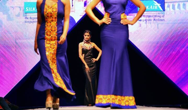 Models wearing designers clothes walk on the stage during the first day of TGIF Nepal Fashion week in Kathmandu, Nepal, March 30, 2016. The four-day fashion week will present both domestic and foreign designers creations. ) NEPAL-KATHMANDU-TGIF NEPAL FASHION WEEK SunilxSharma 