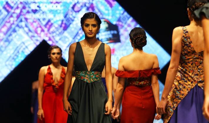 Models wearing designers clothes walk on the stage during the first day of TGIF Nepal Fashion week in Kathmandu, Nepal, March 30, 2016. The four-day fashion week will present both domestic and foreign designers creations. ) NEPAL-KATHMANDU-TGIF NEPAL FASHION WEEK SunilxSharma 