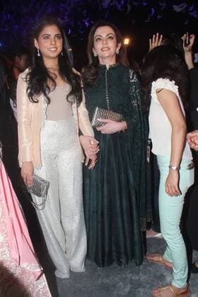 MUMBAI, INDIA - MARCH 29: Nita Ambani, Founder and Chairperson, Reliance Foundation along with her daughter Isha Ambani during the opening show of Lakme Fashion Week Summer Resort 2016, at Mehboob Studio, Bandra on March 29, 2016 in Mumbai, India. (Photo by Pramod Thakur Hindustan Times ) Lakme Fashion Week Summer Resort 2016