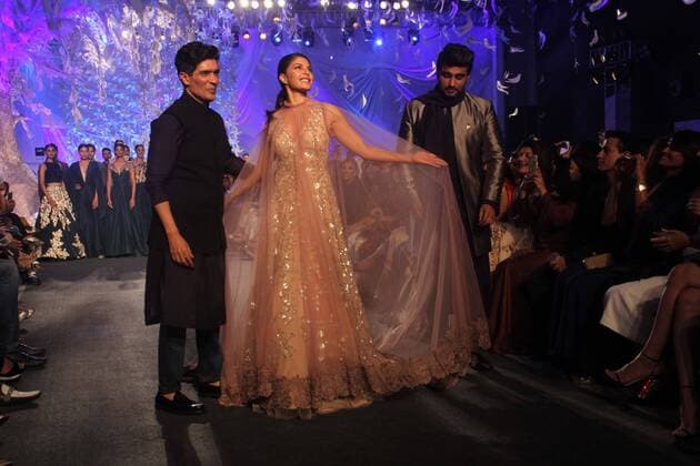 MUMBAI, INDIA - MARCH 29: Indian fashion designer Manish Malhotra with Bollywood actors Arjun Kapoor and Jacqueline Fernandez during the opening show of Lakme Fashion Week Summer Resort 2016, at Mehboob Studio, Bandra on March 29, 2016 in Mumbai, India. (Photo by Pramod Thakur Hindustan Times ) Lakme Fashion Week Summer Resort 2016
