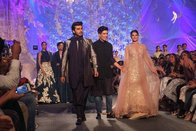 MUMBAI, INDIA - MARCH 29: Indian fashion designer Manish Malhotra with Bollywood actors Arjun Kapoor and Jacqueline Fernandez during the opening show of Lakme Fashion Week Summer Resort 2016, at Mehboob Studio, Bandra on March 29, 2016 in Mumbai, India. (Photo by Pramod Thakur Hindustan Times ) Lakme Fashion Week Summer Resort 2016