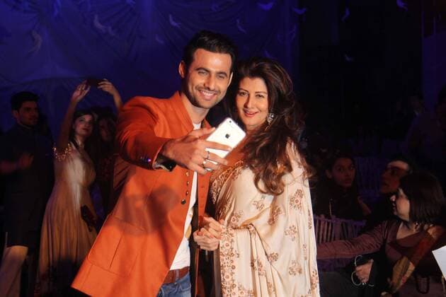 MUMBAI, INDIA - MARCH 29: Indian model Freddy Daruwala with Bollywood actor Sangeeta Bijlani during the opening show of Lakme Fashion Week Summer Resort 2016, at Mehboob Studio, Bandra on March 29, 2016 in Mumbai, India. (Photo by Pramod Thakur Hindustan Times ) Lakme Fashion Week Summer Resort 2016