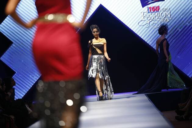 March 31, 2016 - Kathmandu, Nepal - Nepalese models catwalk on the runway on the second day of Nepal fashion week also known as The Himalayan Times TGIF Nepal Fashion Week at Hyatt Regency in Kathmandu, Nepal on Thursday, March 31, 2016. Celebrities and fashion models from around the world come to represent for the designers to promote their designs. The event is the top most fashion week of the country held annually by The Himalayan Times, a leading and largest selling English daily newspaper in Nepal. The fashion week lasts for 4 days with glitz and glamor on the catwalk. Kathmandu Nepal - ZUMAg200