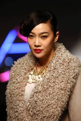 Models showcase fashion designs by Zoual Yanti during China s fashion week in Beijing on March 31, 2016. Chinese fashion designers are becoming an international force with both European and American fashion houses looking at the new, fresh Chinese clothing-minds as potential partners in future clothing brands.  PEK2016033109 STEPHENxSHAVER