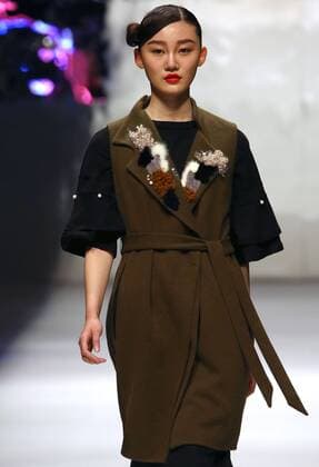 Models showcase fashion designs by Zoual Yanti during China s fashion week in Beijing on March 31, 2016. Chinese fashion designers are becoming an international force with both European and American fashion houses looking at the new, fresh Chinese clothing-minds as potential partners in future clothing brands.  PEK2016033111 STEPHENxSHAVER