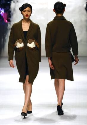 Models showcase fashion designs by Zoual Yanti during China s fashion week in Beijing on March 31, 2016. Chinese fashion designers are becoming an international force with both European and American fashion houses looking at the new, fresh Chinese clothing-minds as potential partners in future clothing brands.  PEK2016033112 STEPHENxSHAVER