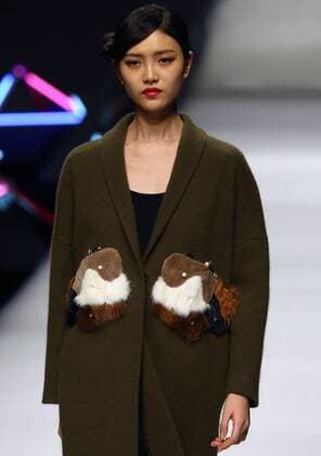 Models showcase fashion designs by Zoual Yanti during China s fashion week in Beijing on March 31, 2016. Chinese fashion designers are becoming an international force with both European and American fashion houses looking at the new, fresh Chinese clothing-minds as potential partners in future clothing brands.  PEK2016033113 STEPHENxSHAVER