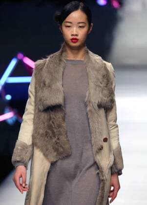 Models showcase fashion designs by Zoual Yanti during China s fashion week in Beijing on March 31, 2016. Chinese fashion designers are becoming an international force with both European and American fashion houses looking at the new, fresh Chinese clothing-minds as potential partners in future clothing brands.  PEK2016033115 STEPHENxSHAVER