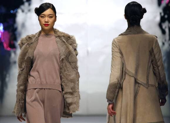 Models showcase fashion designs by Zoual Yanti during China s fashion week in Beijing on March 31, 2016. Chinese fashion designers are becoming an international force with both European and American fashion houses looking at the new, fresh Chinese clothing-minds as potential partners in future clothing brands.  PEK2016033116 STEPHENxSHAVER