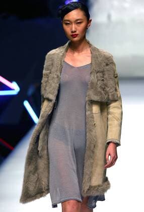Models showcase fashion designs by Zoual Yanti during China s fashion week in Beijing on March 31, 2016. Chinese fashion designers are becoming an international force with both European and American fashion houses looking at the new, fresh Chinese clothing-minds as potential partners in future clothing brands.  PEK2016033118 STEPHENxSHAVER