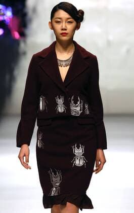 Models showcase fashion designs by Zoual Yanti during China s fashion week in Beijing on March 31, 2016. Chinese fashion designers are becoming an international force with both European and American fashion houses looking at the new, fresh Chinese clothing-minds as potential partners in future clothing brands.  PEK2016033119 STEPHENxSHAVER