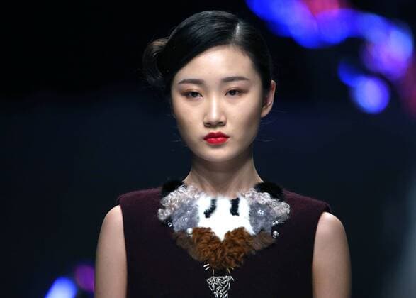 Models showcase fashion designs by Zoual Yanti during China s fashion week in Beijing on March 31, 2016. Chinese fashion designers are becoming an international force with both European and American fashion houses looking at the new, fresh Chinese clothing-minds as potential partners in future clothing brands.  PEK2016033120 STEPHENxSHAVER