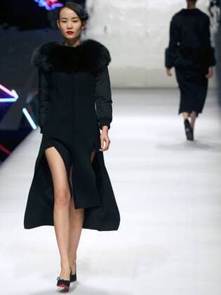 Models showcase fashion designs by Zoual Yanti during China s fashion week in Beijing on March 31, 2016. Chinese fashion designers are becoming an international force with both European and American fashion houses looking at the new, fresh Chinese clothing-minds as potential partners in future clothing brands.  PEK2016033124 STEPHENxSHAVER