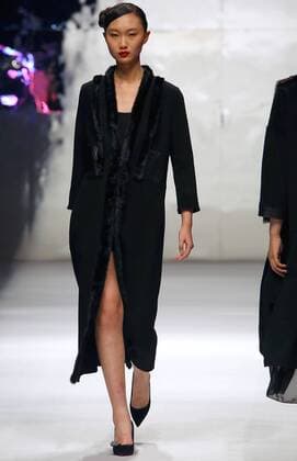 Models showcase fashion designs by Zoual Yanti during China s fashion week in Beijing on March 31, 2016. Chinese fashion designers are becoming an international force with both European and American fashion houses looking at the new, fresh Chinese clothing-minds as potential partners in future clothing brands.  PEK2016033127 STEPHENxSHAVER