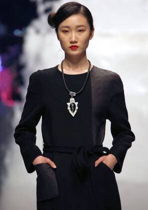 Models showcase fashion designs by Zoual Yanti during China s fashion week in Beijing on March 31, 2016. Chinese fashion designers are becoming an international force with both European and American fashion houses looking at the new, fresh Chinese clothing-minds as potential partners in future clothing brands.  PEK2016033128 STEPHENxSHAVER