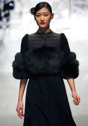 Models showcase fashion designs by Zoual Yanti during China s fashion week in Beijing on March 31, 2016. Chinese fashion designers are becoming an international force with both European and American fashion houses looking at the new, fresh Chinese clothing-minds as potential partners in future clothing brands.  PEK2016033129 STEPHENxSHAVER
