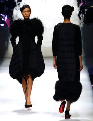 Models showcase fashion designs by Zoual Yanti during China s fashion week in Beijing on March 31, 2016. Chinese fashion designers are becoming an international force with both European and American fashion houses looking at the new, fresh Chinese clothing-minds as potential partners in future clothing brands.  PEK2016033130 STEPHENxSHAVER