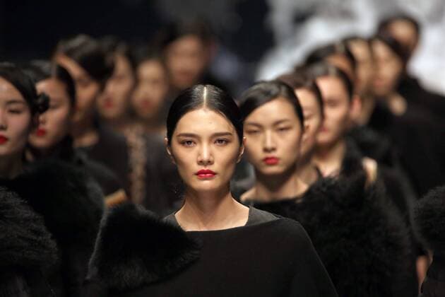 Models showcase fashion designs by Zoual Yanti during China s fashion week in Beijing on March 31, 2016. Chinese fashion designers are becoming an international force with both European and American fashion houses looking at the new, fresh Chinese clothing-minds as potential partners in future clothing brands.  PEK2016033134 STEPHENxSHAVER