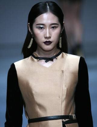Models showcase fashion designs by Zoual Yanti during China s fashion week in Beijing on March 31, 2016. Chinese fashion designers are becoming an international force with both European and American fashion houses looking at the new, fresh Chinese clothing-minds as potential partners in future clothing brands.  PEK2016033139 STEPHENxSHAVER