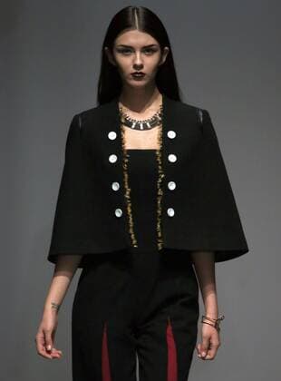 Models showcase fashion designs by Zoual Yanti during China s fashion week in Beijing on March 31, 2016. Chinese fashion designers are becoming an international force with both European and American fashion houses looking at the new, fresh Chinese clothing-minds as potential partners in future clothing brands.  PEK2016033142 STEPHENxSHAVER