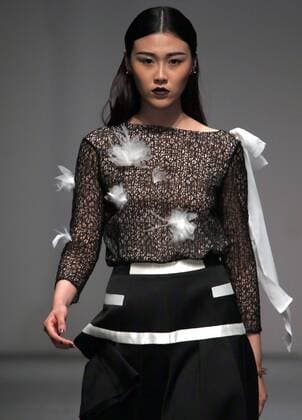 Models showcase fashion designs by Zoual Yanti during China s fashion week in Beijing on March 31, 2016. Chinese fashion designers are becoming an international force with both European and American fashion houses looking at the new, fresh Chinese clothing-minds as potential partners in future clothing brands.  PEK2016033148 STEPHENxSHAVER