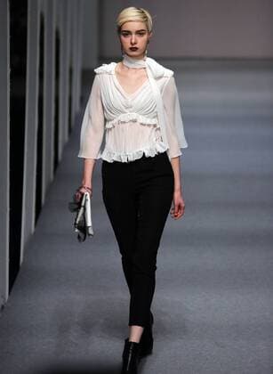 Models showcase fashion designs by Zoual Yanti during China s fashion week in Beijing on March 31, 2016. Chinese fashion designers are becoming an international force with both European and American fashion houses looking at the new, fresh Chinese clothing-minds as potential partners in future clothing brands.  PEK2016033107 STEPHENxSHAVER