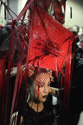 BEIJING, CHINA - MARCH 31: (CHINA OUT) A model prepares at backstage prior to the Sheguang Hu Collection during the Mercedes-Benz China Fashion Week Autumn Winter 2016 2017 at 751D.Park on March 31, 2016 in Beijing, China.  CFP481979937