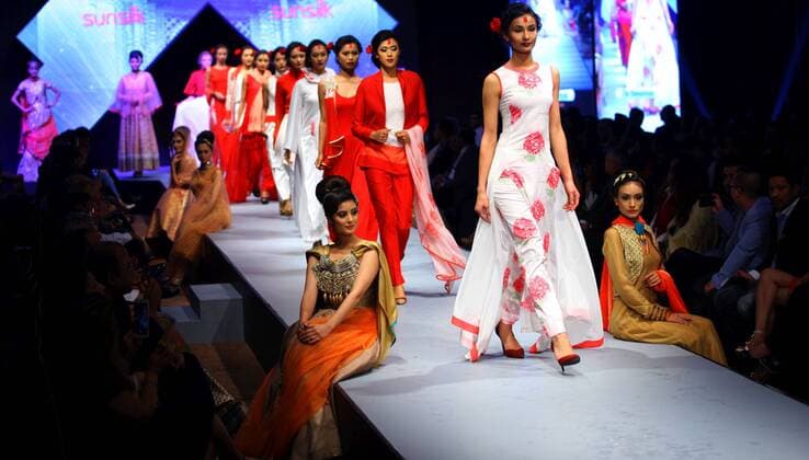 Models walk on the stage during the last day of TGIF Nepal Fashion week in Kathmandu, Nepal, April 2, 2016. The four-day fashion week presented both domestic and foreign designers creations. ) NEPAL-KATHMANDU-TGIF FASHION WEEK SunilxSharma 