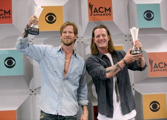 (L-R) Singers Brian Kelley and Tyler Hubbard of Florida Georgia Line, winners of Vocal Duo of the Year award, backstage at the 51st annual Academy of Country Music Awards held at the MGM Grand Arena in Las Vegas, Nevada on April 3, 2016.  LAV20160403401 JIMxRUYMEN