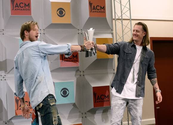 (L-R) Singers Brian Kelley and Tyler Hubbard of Florida Georgia Line, winners of Vocal Duo of the Year award, backstage at the 51st annual Academy of Country Music Awards held at the MGM Grand Arena in Las Vegas, Nevada on April 3, 2016.  LAV20160403402 JIMxRUYMEN
