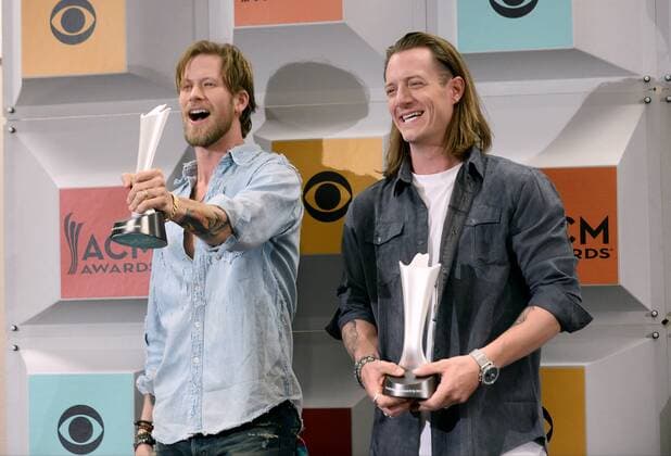 (L-R) Singers Brian Kelley and Tyler Hubbard of Florida Georgia Line, winners of Vocal Duo of the Year award, backstage at the 51st annual Academy of Country Music Awards held at the MGM Grand Arena in Las Vegas, Nevada on April 3, 2016.  LAV20160403398 JIMxRUYMEN