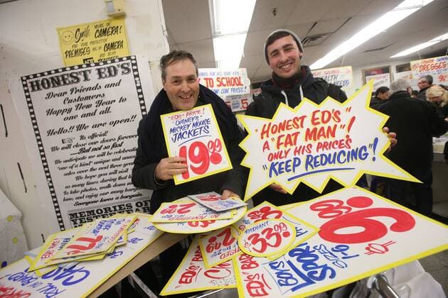 April 3, 2016 - Toronto, ON, Canada - TORONTO, ON - APRIL 3 - -Luciano Iacobelli(left) with his son Julian hold up signs that they want to buy at Honest Ed s hand painted sign sale. Toronto Canada  - ZUMAt14_