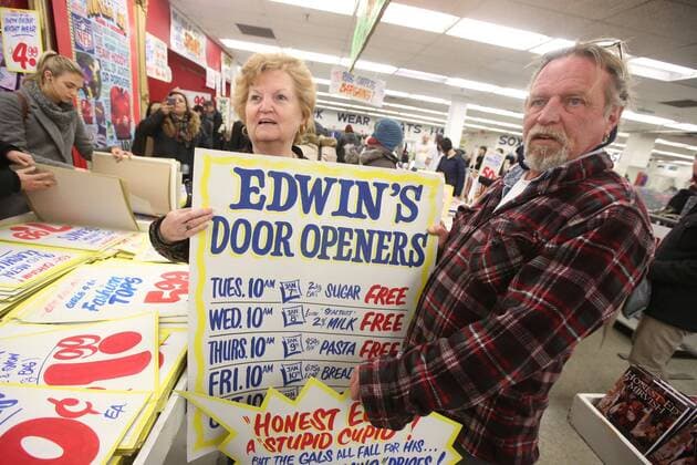 April 3, 2016 - Toronto, ON, Canada - TORONTO, ON - APRIL 3 - -Edith Vinciarelli with her son Donald Stewart holds up a sign that she wants to buy at Honest Ed s hand painted sign sale. Toronto Canada  - ZUMAt14_