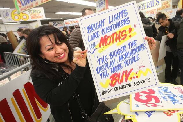 April 3, 2016 - Toronto, ON, Canada - TORONTO, ON - APRIL 3 - -Miriam Cadena holds up a sign that she wants to buy at Honest Ed s hand painted sign sale. Toronto Canada  - ZUMAt14_