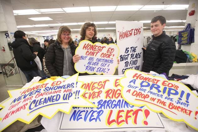 April 3, 2016 - Toronto, ON, Canada - TORONTO, ON - APRIL 3 - -Jennifer Greenwood with her son s Ethan(right) and Cooper hold up a signs that they want to buy at Honest Ed s hand painted sign sale. Toronto Canada  - ZUMAt14_