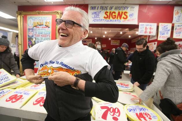 April 3, 2016 - Toronto, ON, Canada - TORONTO, ON - APRIL 3 - -Russell Lazar, General Manager Honest Ed s puts on a Honest Ed s shirt at Honest Ed s hand painted sign sale. Toronto Canada  - ZUMAt14_