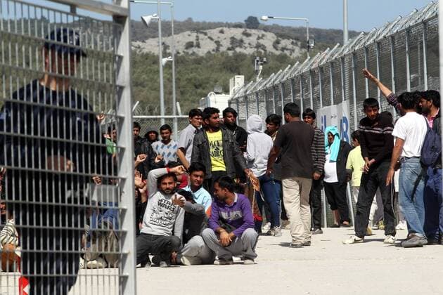 (160405) -- LESBOS, April 5, 2016 -- Refugees and migrants protest against EU-Turkey migration deal inside the entrance of Moria camp in the Greek island of Lesbos on Tuesday, April 5, 2016. Authorities in Greece have paused deportations to Turkey and acknowledged that most migrants and refugees detained on the islands have applied for asylum. ) GREECE-LESBOS-MIGRANTS MariosxLolos 