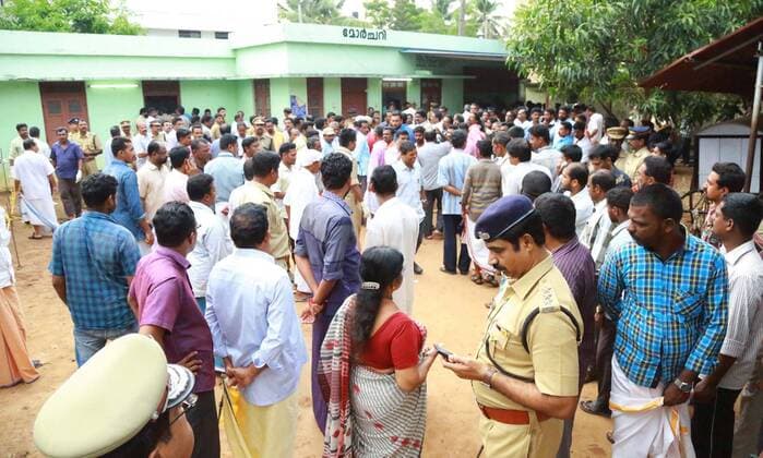 (160410) -- KERALA (INDIA), April 10, 2016 -- People gather outside a mortuary near the site of the Puttingal Devi temple fire in the southern Indian state Kerala, on April 10, 2016. In a major tragedy, over 80 people, including some policemen, were killed and 250 injured in a major fire caused by festive firework at the famous Puttingal Devi temple in Paravur, Kollam of the southern Indian state Kerala early Sunday morning, said police. INDIA-KERALA-PUTTINGAL DEVI TEMPLE-FIRE Stringer 