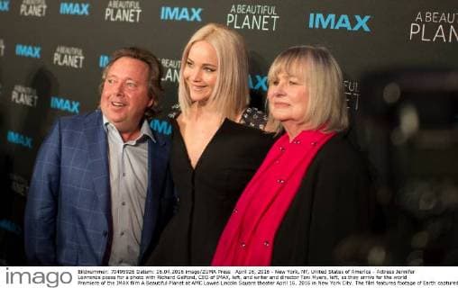 April 16, 2016 - New York, NY, United States of America - Actress Jennifer Lawrence poses for a photo with Richard Gelfond, CEO of IMAX, left, and writer and director Toni Myers, left, as they arrive for the world Premiere of the IMAX film A Beautiful Planet at AMC Lowes Lincoln Square theater April 16, 2016 in New York City. The film features footage of Earth captured by astronauts aboard the International Space Station. New York United States of America - ZUMAp138