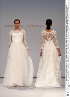 Models take to the catwalk wearing wedding dresses designed by Spanish Hannibal Laguna during the Pasarela Costura fashion show held at the Cibeles Palace in Madrid, Spain, on 19 April 2016. PASARELA COSTURA !ACHTUNG: NUR REDAKTIONELLE NUTZUNG!  20160419-635966770842408763