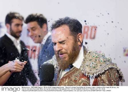 Spanish actress Ingrid Garcia Jonsson brake a bottle on the head of Llimoo, the host of the late show Late Motiv during the premiere of the spanish film Toro at Kinepolis Cinemas in Madrid. April 20, 2016.  (20160420060)
