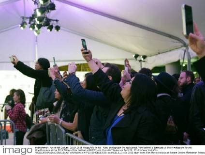 Fans photograph the red carpet from behind a barricade at the A Hologram for the King Premiere at the 2016 Tribeca Film Festival at BMCC John Zuccotti Theater on April 20, 2016 in New York City.  NYP20160420103 JOHNxANGELILLO