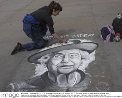 London, UK. 21 April 2016. Street artist Natalia from Alicante, Spain, draws a chalk portrait of Queen Elizabeth in Trafalgar Square in honour of her 90th birthday. The Queen s 90th Birthday, London, UK 