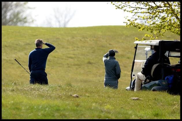 . 23 04 2016. London, United Kingdom. David Cameron and President Obama playing golf. The British Prime Minister David Cameron looks for his ball as he plays President of the United States President Obama (out of shot) at golf at the Grove Golf Club.  xAndrewxParsonsx xi-Imagesx IIM-12491-0015
