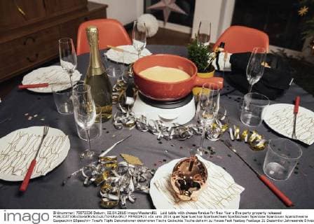 Laid table with cheese fondue for New Year s Eve party property released  MFF002923